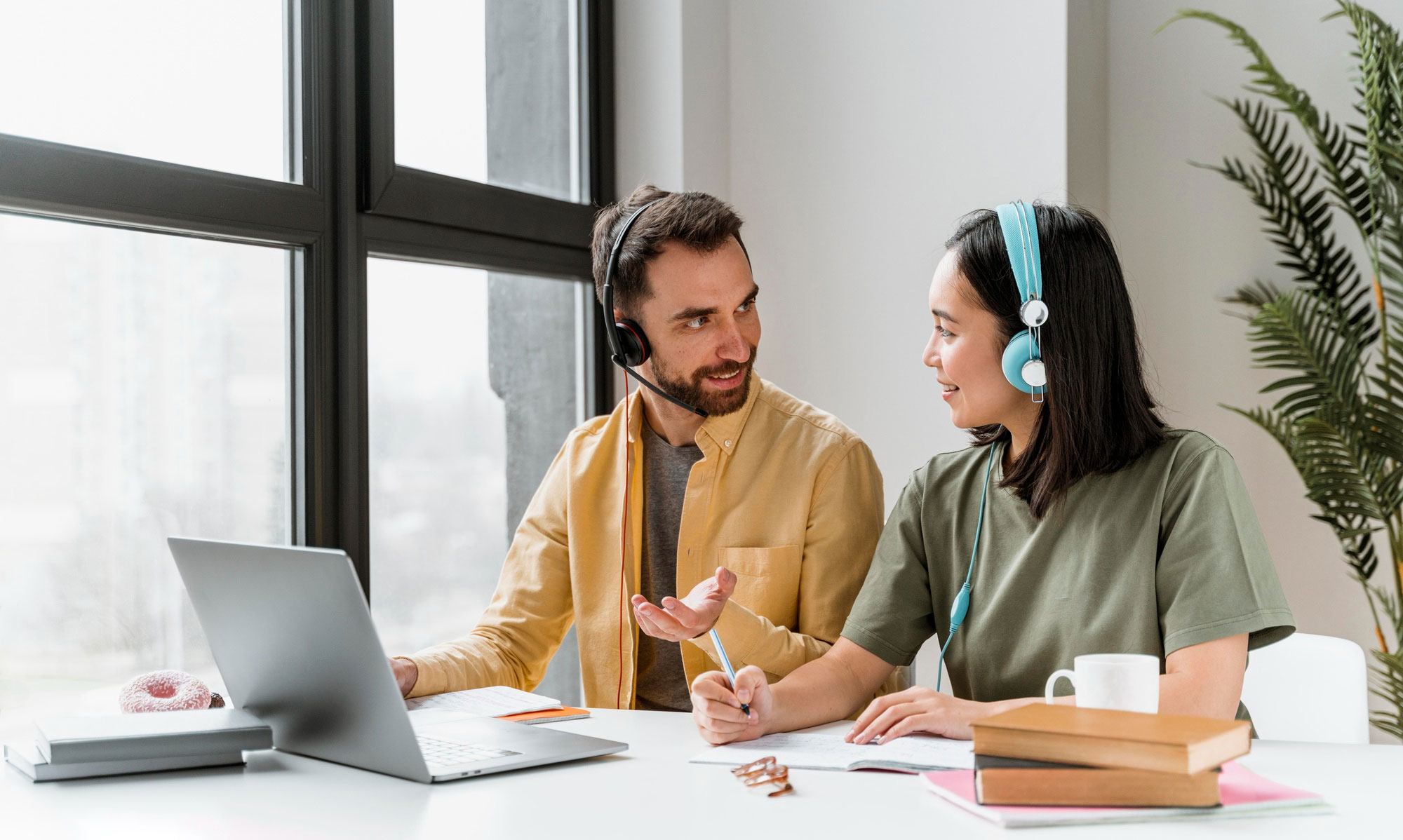 Two people wearing headsets during a video remote interpreting session